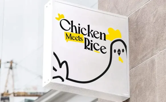 Chicken Meets Rice wayfinding signage featuring the new brand identity