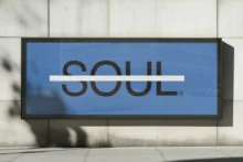 A billboard with one large, all-cap word, "SOUL," crossed out