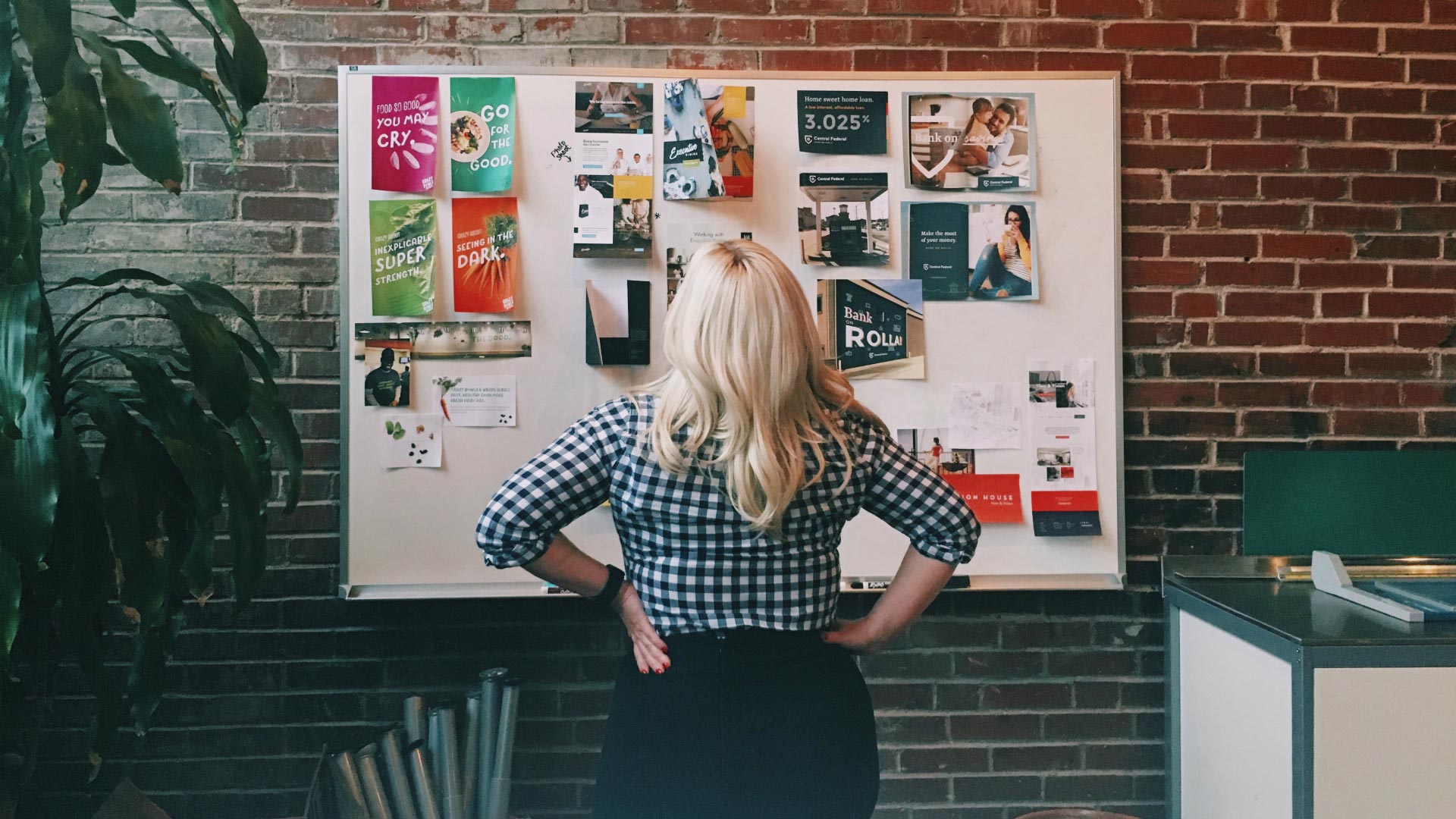 Jazzy standing in front of a board of brand concepts