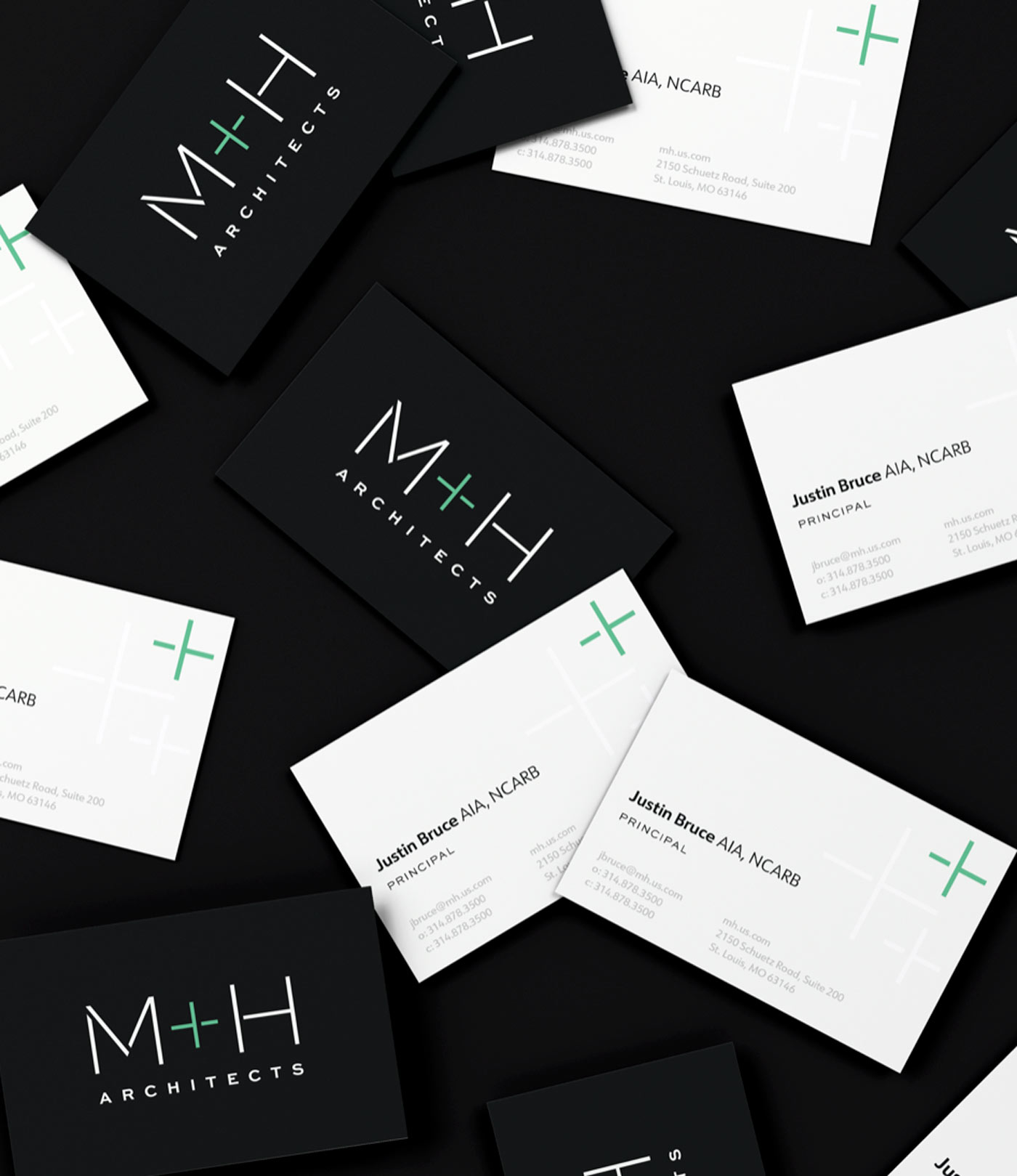 Business cards showing the new M+H Architects brand identity