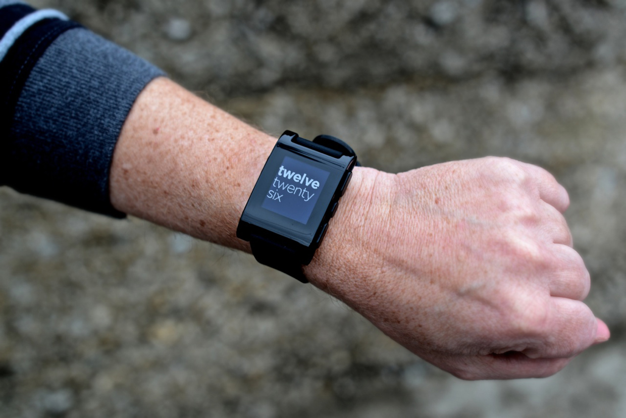 The pebble watch on a man's wrist