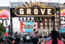 The Grove Fest 20th anniversary brand identity on stage signage for the festival's live music