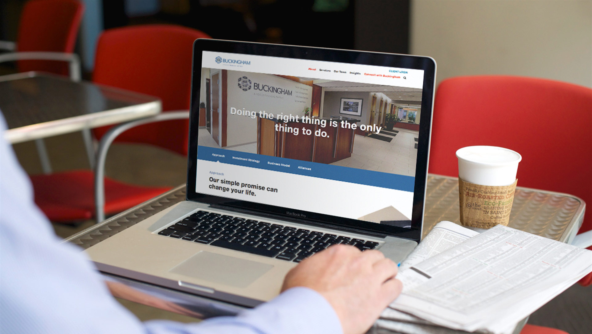 Person on laptop uses the new Buckingham Wealth Management website design