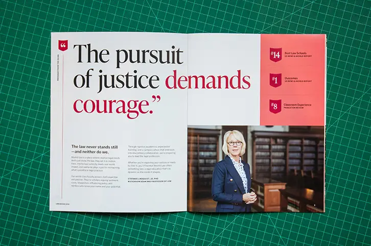 WashU Law brochure spread featuring quote ‘The pursuit of justice demands courage’ with professional faculty portrait and ranking highlights.