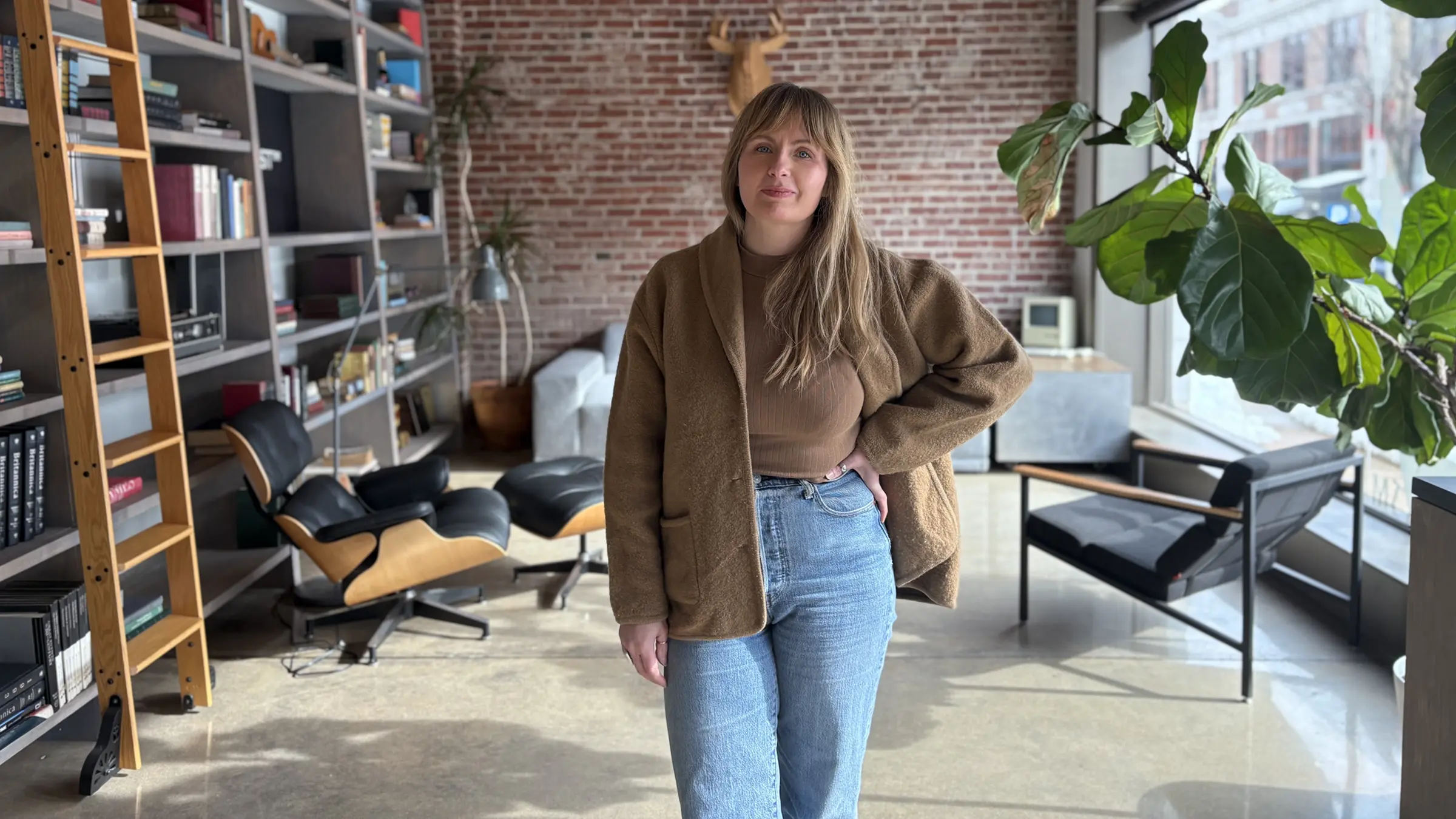 Designer Frances Foster stands in the lobby of Atomicdust in St. Louis