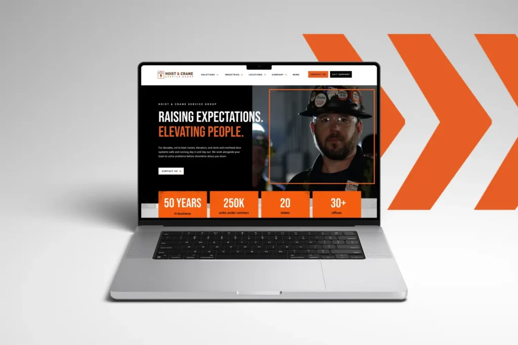 The Hoist & Crane Service Group website on a laptop