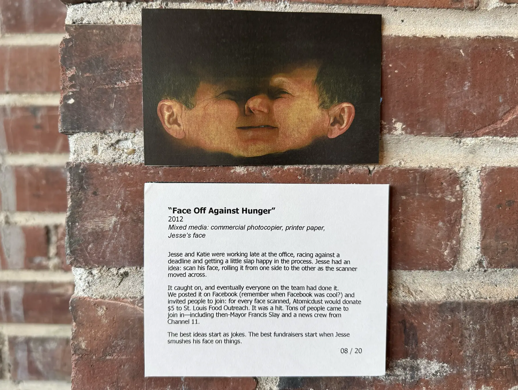 A distorted photocopier scan of Jesse’s face on a brick wall, above an exhibit placard titled “Face Off Against Hunger”