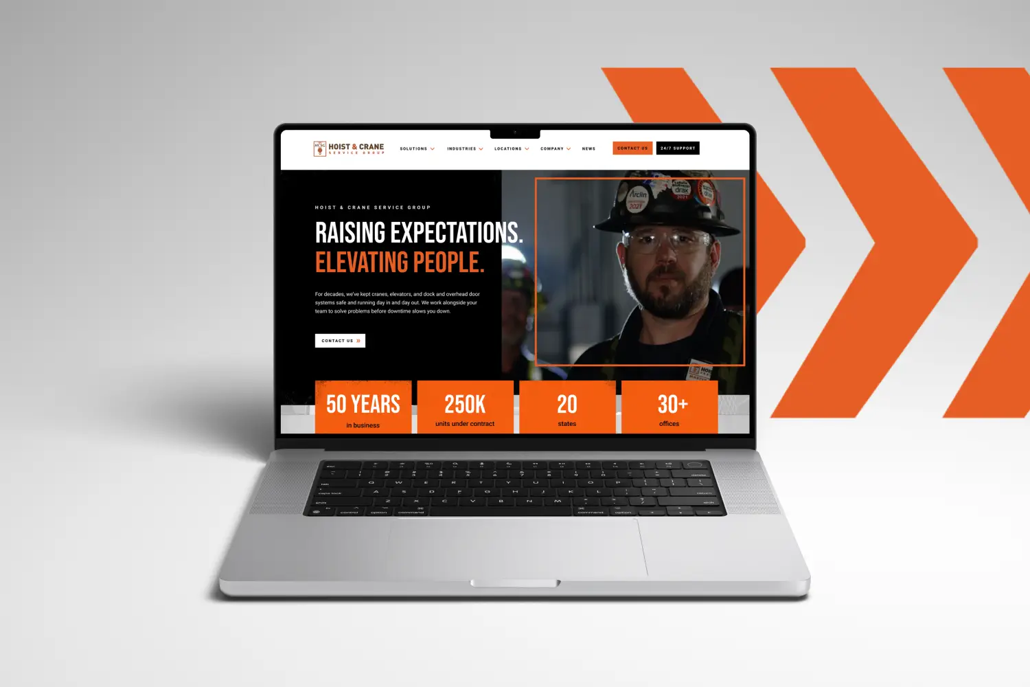 The Hoist & Crane Service Group website on a laptop