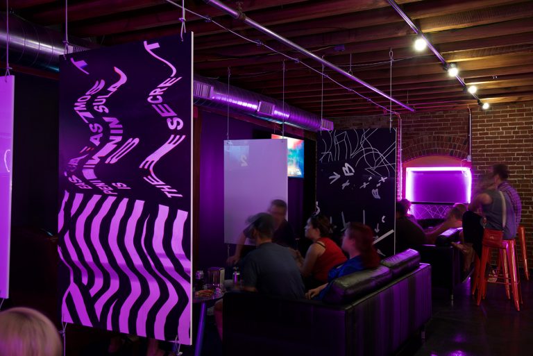Crowd enjoying the video game console suites at Start Bar