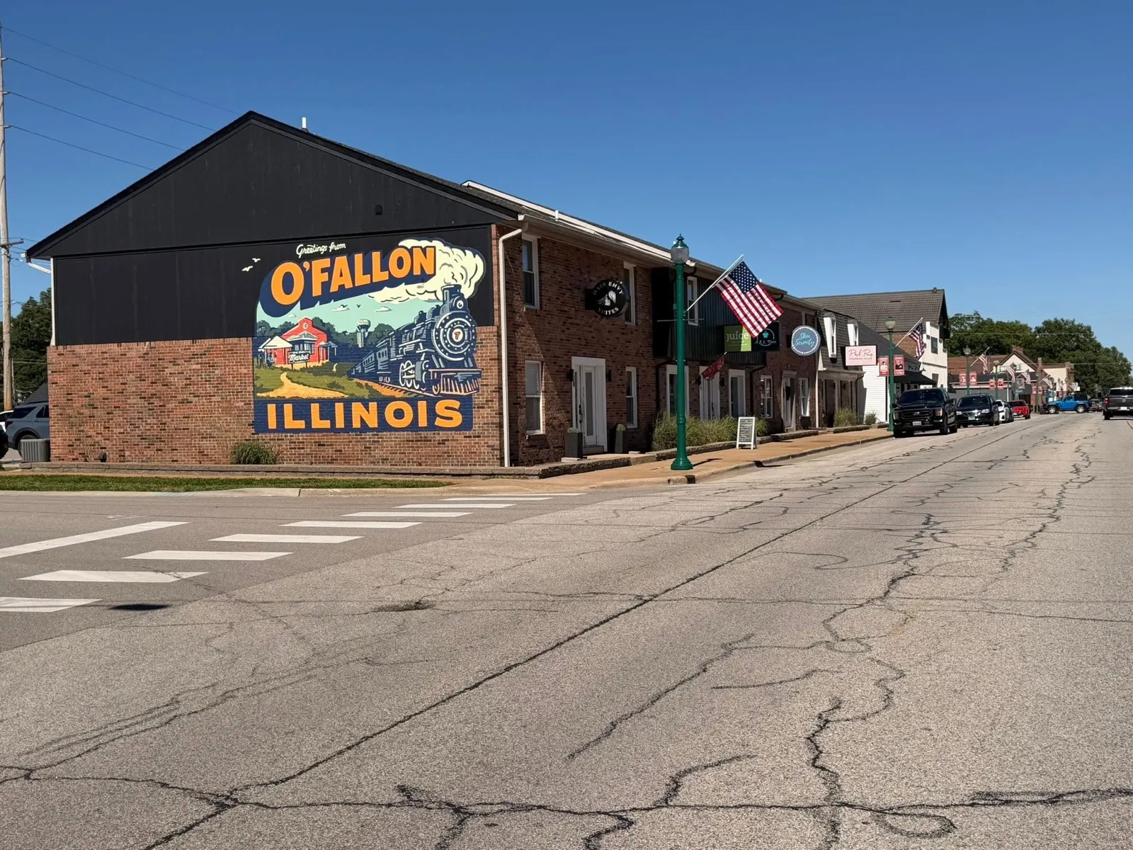 The 'Greetings from O'Fallon, Illinois' mural on a downtown building