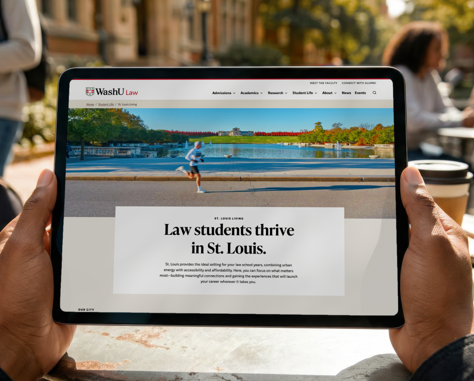 An iPad on the WashU Law campus showing a page from the newly design WashU Law website.