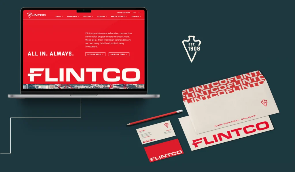 The Flintco website on a laptop and branded materials like business cards and envelopes