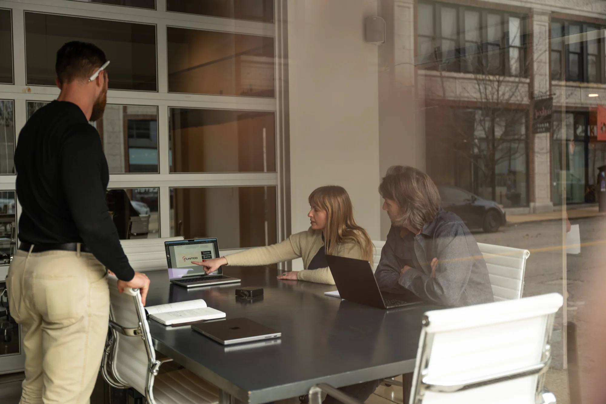 The Atomicdust team working through content strategy in the conference room