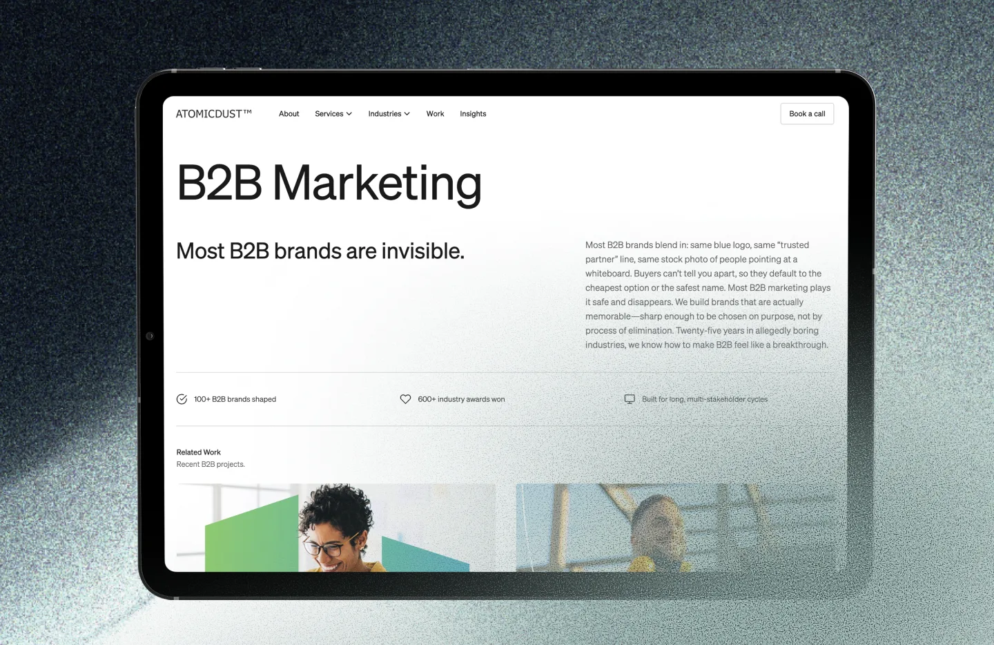 Atomicdust's B2B Marketing page on a tablet, headlined 'Most B2B brands are invisible'