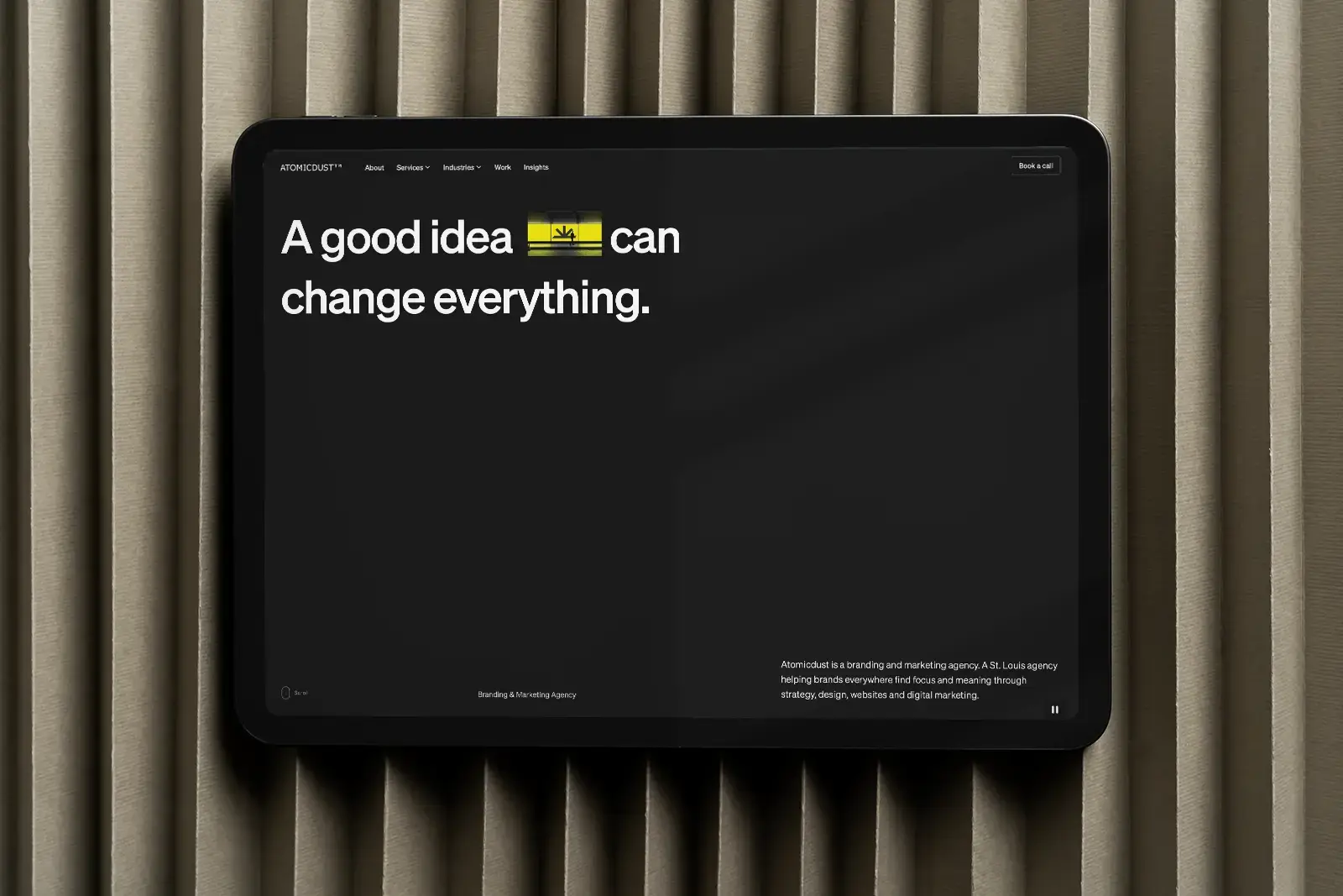 The Atomicdust website homepage design on a tablet